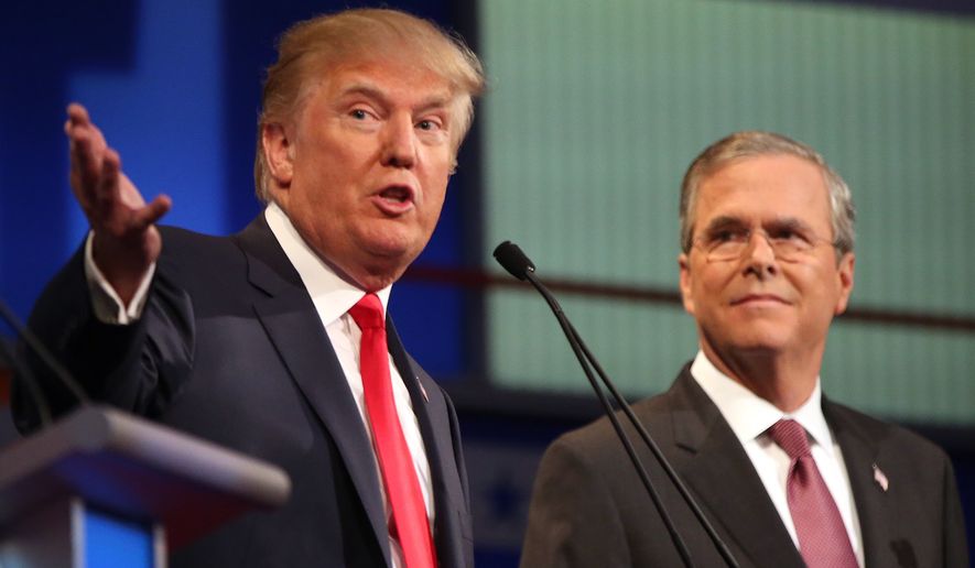 Republican presidential candidates Donald Trump and Jeb Bush participate during the first Republican presidential debate at the Quicken Loans Arena Thursday, Aug. 6, 2015, in Cleveland. (AP Photo/Andrew Harnik) ** FILE **