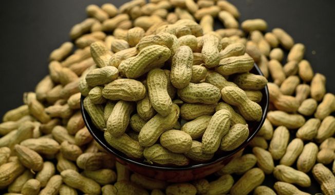 This Feb. 20, 2015, photo shows an arrangement of peanuts in New York. (Associated Press) **FILE**