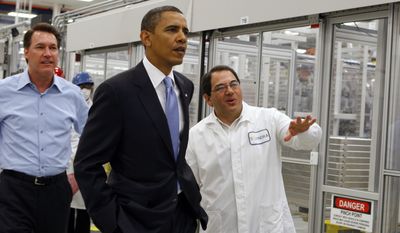 President Obama is given a tour of Solyndra by Executive Vice President Ben Bierman (right) as Chief Executive Officer Chris Gronet walks along at Solyndra Inc. in Fremont, Calif., on May 26, 2010. (Associated Press)