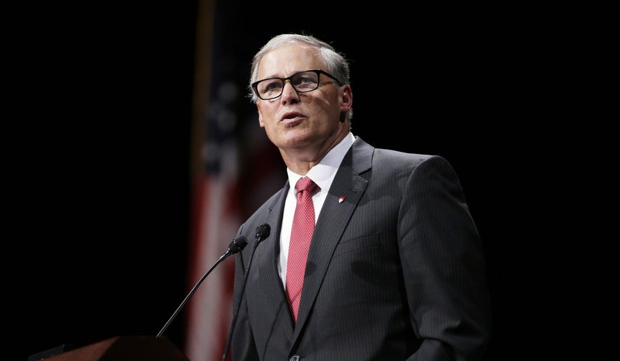 Washington Gov. Jay Inslee speaks during a memorial service for the late Washington State University President Elson Floyd, who passed away in June due to complications from colon cancer, at Beasley Coliseum on the school&#39;s campus in Pullman, Wash., Wednesday, Aug. 26, 2015. (AP Photo/Young Kwak)