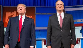 In this photo taken Aug. 6, 2015, Republican presidential candidates Donald Trump and former Florida Gov. Jeb Bush, take the stage for the first Republican presidential debate at the Quicken Loans Arena in Cleveland. Donald Trump is used to controlling his world like the boss he is. But as president, he’d answer to the people. And so far in the rollicking 2016 presidential contest, he’s showing little willingness to dial down his because-I-said-so style. (AP Photo/Andrew Harnik)