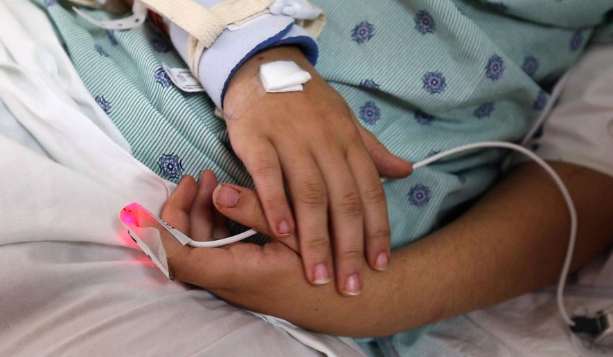 ADVANCE FOR SUNDAY AUG. 30 - In this Thursday, Aug. 13, 2015 photo, Hope DeHart, 18, who was shot in the head and left for dead on a road in north Fort Worth and is making a miraculous recovery at JPS Hospital in Fort Worth, Texas. (Joyce Marshall/Star-Telegram via AP) MAGS OUT; (FORT WORTH WEEKLY, 360 WEST); INTERNET OUT; MANDATORY CREDIT