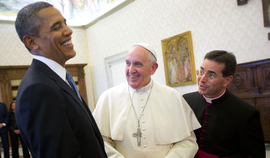 President Obama reacts as he meets with Pope Francis during their exchange of gifts at the Vatican on March 27, 2014. (Associated Press)