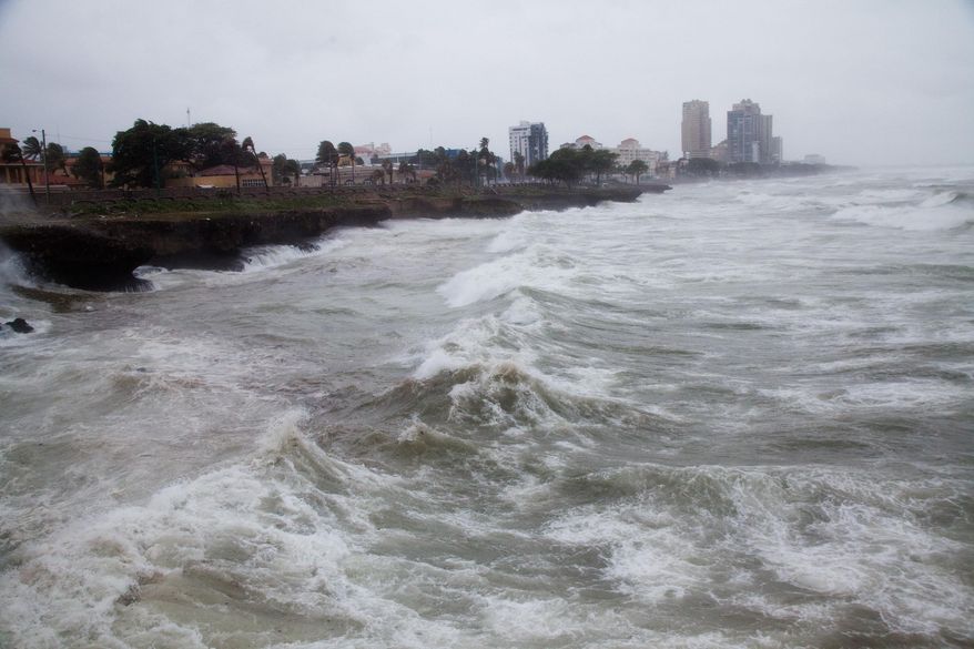 Strong winds and waves batter the coast as Tropical Storm Erika approaches Santo Domingo, in the Dominican Republic, Friday, August 28, 2015. Tropical Storm Erika began to lose steam Friday over the Dominican Republic, but it left behind a trail of destruction that included several people killed on the small eastern Caribbean island of Dominica, authorities said. (AP Photo/Tatiana Fernandez)