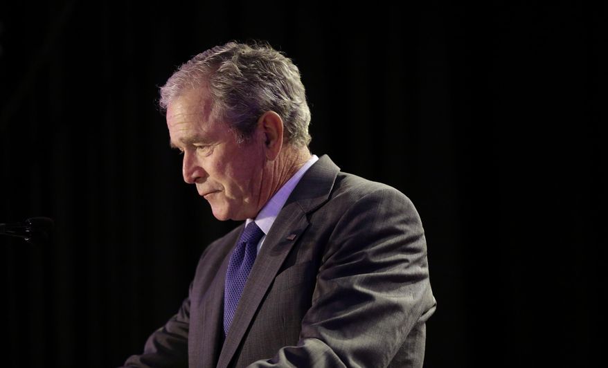 Former President George W. Bush pauses as he delivers remarks at Warren Easton Charter High School in New Orleans, in this file photo from Friday, Aug. 28, 2015. On July 8, 2016, Mr. Bush, who lives in Dallas, Texas, released a statement expressing his condolences to the families of 5 officers slain in the city the night before by a sniper. (AP Photo/Gerald Herbert)