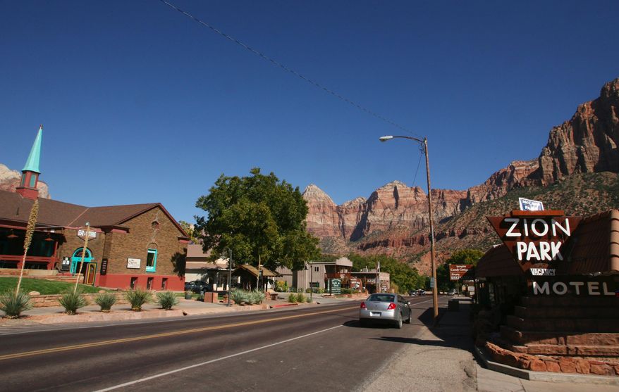 In this Oct. 23, 2008 photo, State Route 9 runs through downtown Springdale, Springdale, a small Utah town outside Zion National Park has repealed a ban on chain restaurants after about a decade of legal battles, clearing the way for one of the country’s biggest fast food chains to open in Springdale amid the village’s mom-and-pop restaurants and cafes. (Jud Burkett/The Spectrum via AP) NO SALES; MANDATORY CREDIT