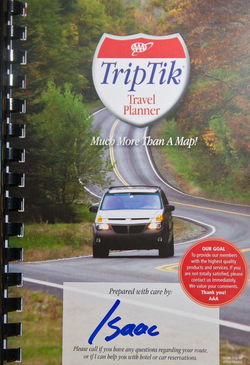 This Aug. 20, 2015 photo shows a TripTik made by Isaac Reilly in Omaha, Neb. Despite being equipped with voice-guided directions, some Americans say they'd be lost without a paper map. (Chris Machian/The World-Herald via AP)