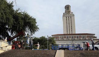 A statue of Confederate President Jefferson Davis is moved from its location in front of the school&#39;s main tower at the University of Texas campus, Sunday, Aug. 30, 2015, in Austin, Texas. The Davis statue, which has been targeted by vandals and had come under increasing criticism, will be moved and placed in the school&#39;s Dolph Briscoe Center for American History as part of an educational display. (AP Photo/Eric Gay)