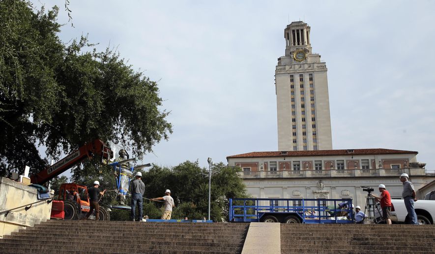 A statue of Confederate President Jefferson Davis is moved from its location in front of the school&#x27;s main tower at the University of Texas campus, Sunday, Aug. 30, 2015, in Austin, Texas. The Davis statue, which has been targeted by vandals and had come under increasing criticism, will be moved and placed in the school&#x27;s Dolph Briscoe Center for American History as part of an educational display. (AP Photo/Eric Gay)
