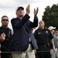 Republican presidential candidate Donald Trump, second left, applauds play as he walks with a crowd during the final round of play at The Barclays golf tournament Sunday, Aug. 30, 2015, in Edison, N.J. (AP Photo/Mel Evans)
