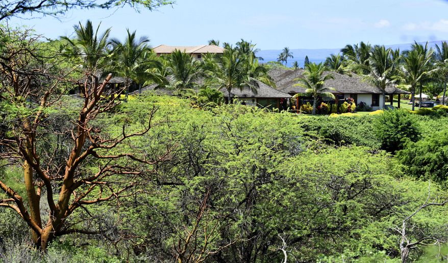 ADVANCE FOR SUNDAY, AUG. 30, 2015 AND THEREAFTER - This undated photo shows a luxury property sold for a record amount of nearly $41.8 million in Wailea, Hawaii. Sitting on 4.23 acres with a sweeping view of the South Maui coastline, the 6,737-square-foot main home has four bedrooms, four full bathrooms and two half baths. A second 1,004-square-foot home has two bedrooms. (Matthew Thayer/ The Maui News via AP)