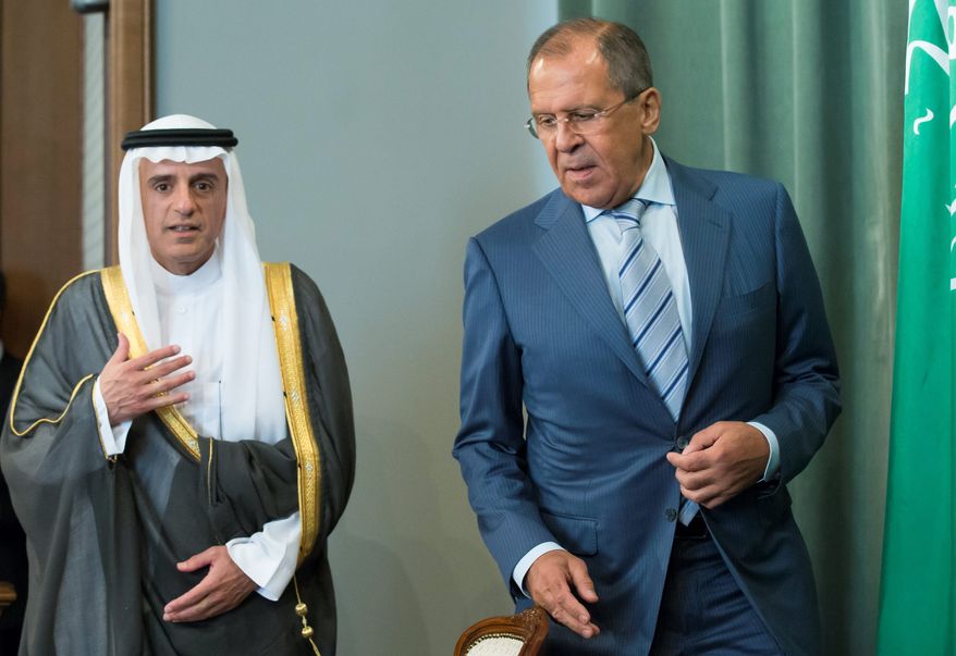 Russian Foreign Minister Sergey Lavrov (right) and Saudi Arabia Foreign Minister Adel al-Jubeir have met with U.S. Secretary of State John F. Kerry to discuss "political transition in Syria." (Associated Press)