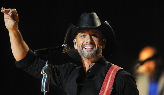 Country singer Tim McGraw performs on stage at the Hammerstein Ballroom on Tuesday, Sept. 16, 2014, in New York. (Photo by Brad Barket/Invision/AP)