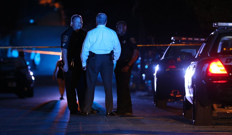 DeKalb County police officers work at the scene where an Atlanta-based officer was shot Monday evening, Aug. 31, 2015, five miles from Atlanta. DeKalb County police spokeswoman Mekka Parrish did not immediately have any details about the circumstances of the shooting. (Ben Gray/Atlanta Journal-Constitution via AP) MARIETTA DAILY OUT; GWINNETT DAILY POST OUT; LOCAL TELEVISION OUT; WXIA-TV OUT; WGCL-TV OUT; MANDATORY CREDIT