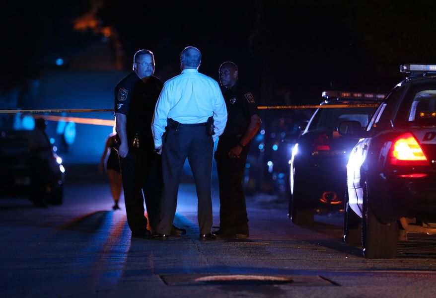 DeKalb County police officers work at the scene where an Atlanta-based officer was shot Monday evening, Aug. 31, 2015, five miles from Atlanta. DeKalb County police spokeswoman Mekka Parrish did not immediately have any details about the circumstances of the shooting. (Ben Gray/Atlanta Journal-Constitution via AP) MARIETTA DAILY OUT; GWINNETT DAILY POST OUT; LOCAL TELEVISION OUT; WXIA-TV OUT; WGCL-TV OUT; MANDATORY CREDIT