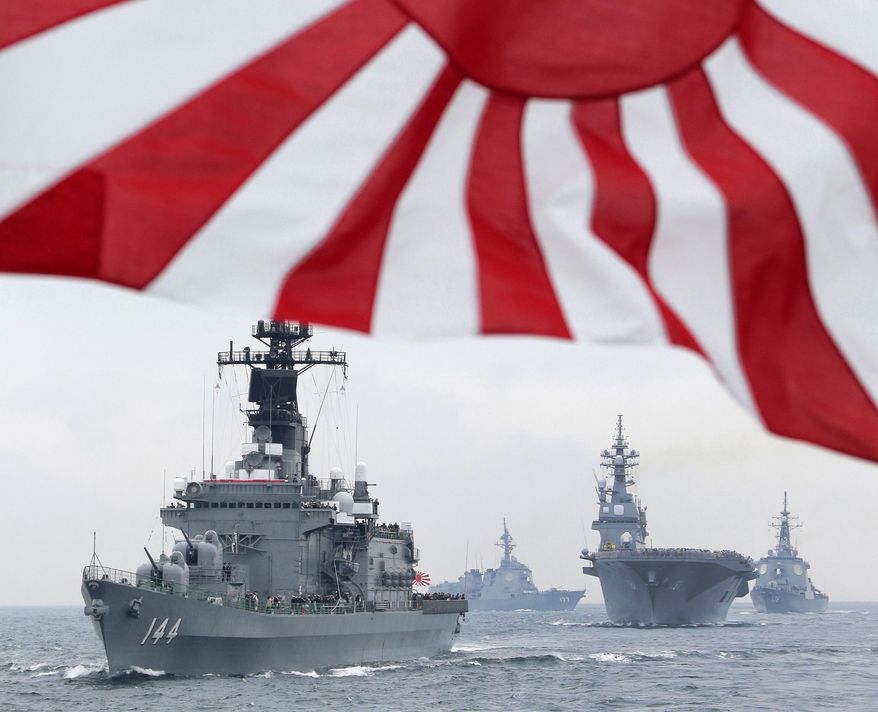 FILE - In this Oct. 14, 2012, file photo, Japan Maritime Self-Defense Force (JMSDF) escort ship Kurama leads other vessels during a fleet review in waters off Sagami, south of Tokyo. Japan's Defense Ministry wants to buy an advanced Aegis radar-equipped destroyer and more F-35 fighters under its largest-ever budget to bolster the defense of southern islands amid a territorial dispute with China. The ministry endorsed a 5.1 trillion yen ($42 billion) budget request Monday, Aug. 31, 2015 for the year beginning next April, up 2.2 percent from this year. It would be the fourth annual increase under Japanese Prime Minister Shinzo Abe, who took office in December 2012 and ended 10 years of defense budget cuts. (AP Photo/Itsuo Inouye, File)