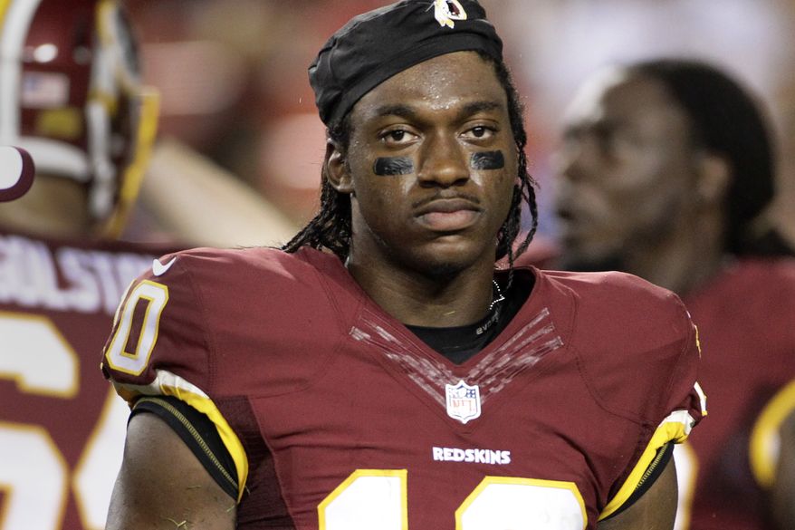 Washington Redskins quarterback Robert Griffin III walks off the field after an injury during the first half of an NFL preseason football game against the Detroit Lions, Thursday, Aug. 20, 2015, in Landover, Md. (AP Photo/Mark Tenally)