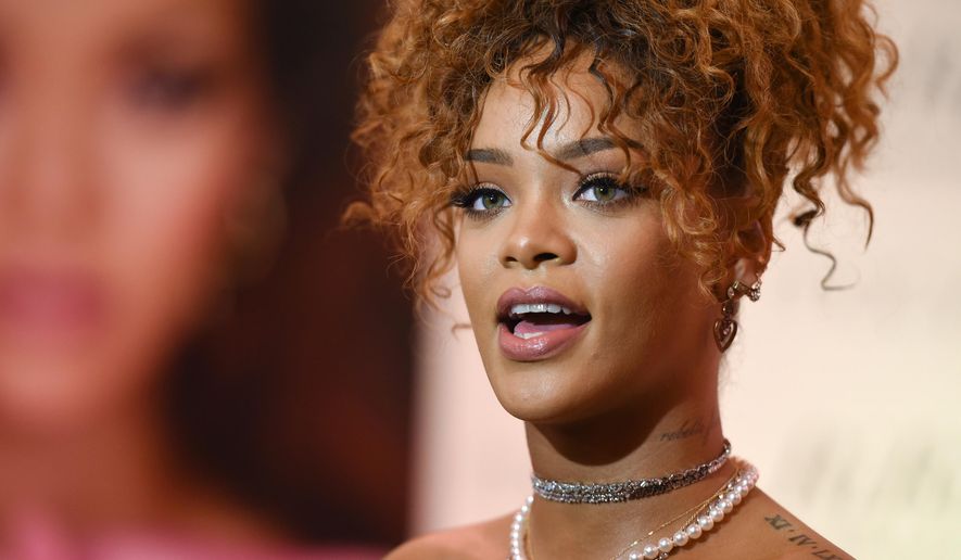 Singer Rihanna attends the "RiRi by Rihanna" fragrance launch at Macy's on Monday, Aug. 31, 2015, in the borough of Brooklyn, N.Y. (Photo by Evan Agostini/Invision/AP)