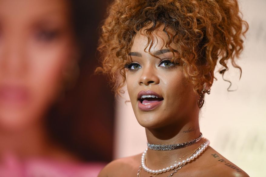 Singer Rihanna attends the "RiRi by Rihanna" fragrance launch at Macy's on Monday, Aug. 31, 2015, in the borough of Brooklyn, N.Y. (Photo by Evan Agostini/Invision/AP)