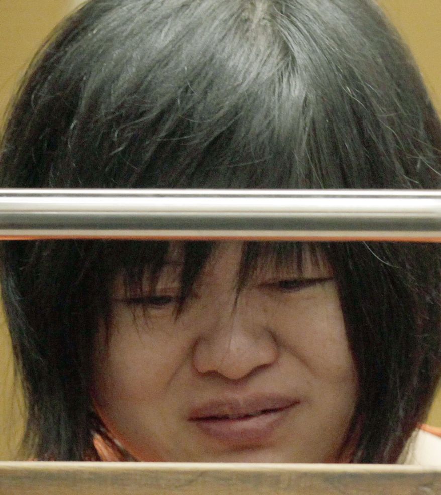 FILE - This March 16, 2012 file photo, Dr Lisa Tseng cries during her arraignment in court in Los Angeles. Attorneys are set to deliver opening statements Monday, Aug. 31, in the trial of Tseng, charged with murder the deaths of three young men who overdosed on prescription pain killers. Tseng has pleaded not guilty to three counts of second-degree murder. She could face up to life in prison if convicted on all the charges against her. (AP Photo/Nick Ut, File)