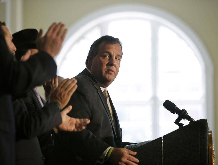 New Jersey Gov. Chris Christie listens to applause after he called on Democratic Sen. Cory Booker and the state&#39;s congressional delegation to join Sen. Bob Menendez in opposing the Iran deal, which aims to dismantle Iran&#39;s nuclear capabilities in exchange for relief from international economic sanctions worth billions of dollars, at the Chabad House at Rutgers University in New Brunswick, N.J., on Aug. 25, 2015. (Associated Press) **FILE**
