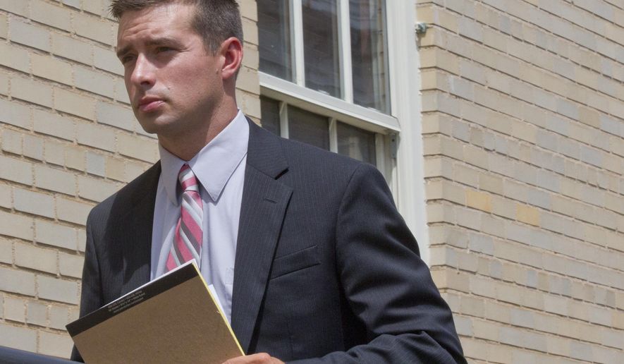 Former Madison, Ala. police officer Eric Sloan Parker walks into a federal courthouse, Tuesday, Sept. 1, 2015, in Huntsville, Ala. Parker is on trial on a federal charge of using excessive force against an Indian man, 58-year-old Sureshbhai Patel, who was thrown down and partially paralyzed during a confrontation in a suburban neighborhood. (AP Photo/Brynn Anderson)