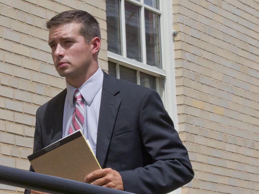 Former Madison, Ala. police officer Eric Sloan Parker walks into a federal courthouse, Tuesday, Sept. 1, 2015, in Huntsville, Ala. Parker is on trial on a federal charge of using excessive force against an Indian man, 58-year-old Sureshbhai Patel, who was thrown down and partially paralyzed during a confrontation in a suburban neighborhood. (AP Photo/Brynn Anderson)