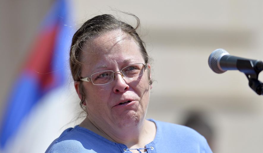 Rowan County, Ky., Clerk Kim Davis shows emotion as she is cheered by a gathering of supporters during a rally on the steps of the Kentucky State Capitol in Frankfort Ky. The U.S. Supreme Court on Monday, Aug. 31, 2015, ruled against Davis, who has refused to issue same-sex marriage licenses. (AP Photo/Timothy D. Easley, File)