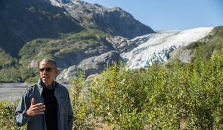 President Barack Obama speaks to members of the media while on a hike to the Exit Glacier in Seward, Alaska, on Sept. 1, 2015, which according to National Park Service research, has retreated approximately 1.25 miles over the past 200 years. (Associated Press) **FILE**