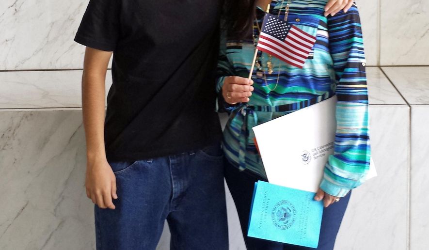 In this April 10, 2015 photo provided by the Benavides family, Daniel Benavides poses with his mother, Maria Luisa Benavides, during a citizenship ceremony in Las Vegas. Daniel Benavides died Tuesday, Sept. 1, 2015, after being struck by a vehicle while crossing a North Las Vegas, Nev., street not far from his high school. Police say speed may be a factor but the cause and manner of his death were still being investigated. Police say the 25-year-old driver of the Dodge SUV remained at the scene after the crash.(Benavides Family via AP)