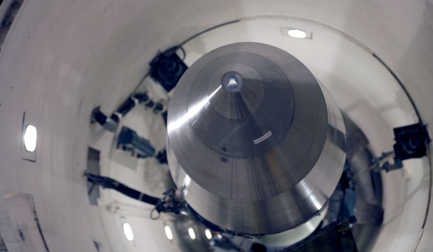 An inert Minuteman 3 missile sits in a training launch tube at Minot Air Force Base, North Dakota. President Obama&#39;s decision to reduce the role of nuclear weapons is being challenged by Russia&#39;s buildup of nuclear forces. (Associated Press)