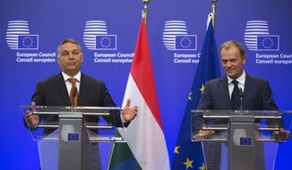 European Council President Donald Tusk, right, and Hungarian Prime Minister Viktor Orban participate in a media conference at the EU Council building in Brussels on Thursday, Sept. 3, 2015. Hungarian Prime Minister Viktor Orban is visiting EU officials on Thursday to discuss the current migration crisis. (AP Photo/Virginia Mayo)