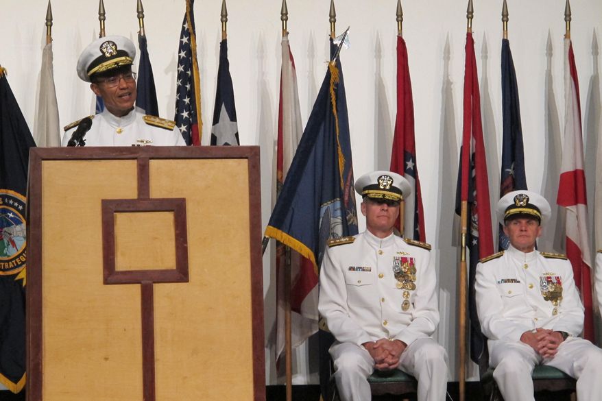 U.S. Strategic Command commander Adm. Cecil Haney, left, speaks at a change of command ceremony in Pearl Harbor, Hawaii on Thursday, Sept. 3, 2015 as Rear Adm. Frederick Roegge, center, and Rear Adm. Phillip Sawyer, right, listen. Roegge took over from Sawyer as the commander of the U.S. Pacific Fleet's submarine force during the ceremony. (AP Photo/Audrey McAvoy)