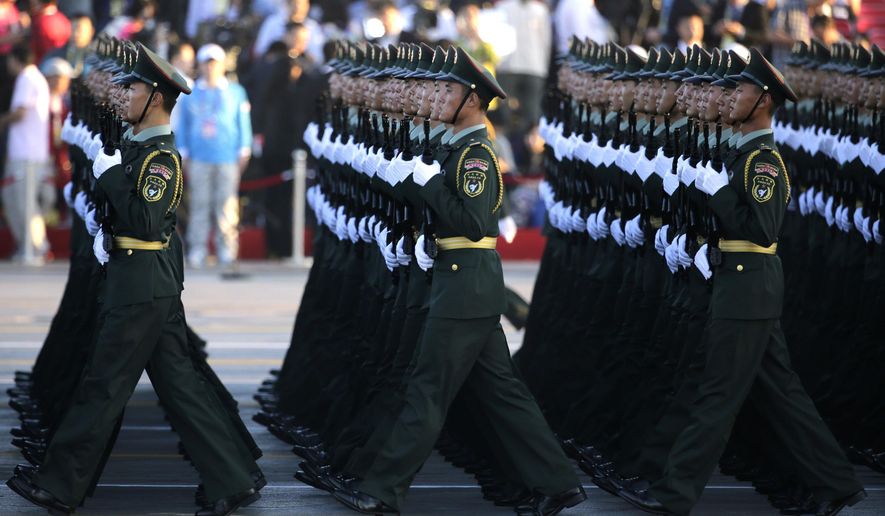 Soldiers of China&#x27;s People Liberation Army (PLA) prepare in front of Tiananmen Gate ahead of a military parade to commemorate the 70th anniversary of the end of World War II in Beijing Thursday Sept. 3, 2015. (Jason Lee/Pool Photo via AP)