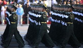 Soldiers of China&#39;s People Liberation Army (PLA) prepare in front of Tiananmen Gate ahead of a military parade to commemorate the 70th anniversary of the end of World War II in Beijing Thursday Sept. 3, 2015. (Jason Lee/Pool Photo via AP)
