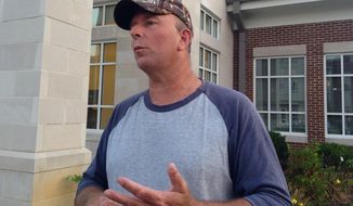 Joe Davis, husband of jailed Rowan County Clerk Kim Davis, speaks to reporters outside the Rowan County Courthouse on Friday, Sept. 4, 2015 in Morehead, Ky.   Davis says his wife  won&#39;t resign and will stay in jail for as long as it takes.  A federal district court judge jailed Kim Davis on Thursday for refusing to obey his order that she issue marriage licenses to gay couples (AP Photo/Bernard McGhee)