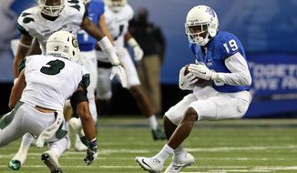 Georgia State wide receiver Robert Davis (19) runs after a reception against Charlotte defensive back Branden Dozier (3) during the first half of an NCAA college football game Friday, Sept. 4, 2015, in Atlanta. (Jason Getz/Atlanta Journal-Constitution via AP) 