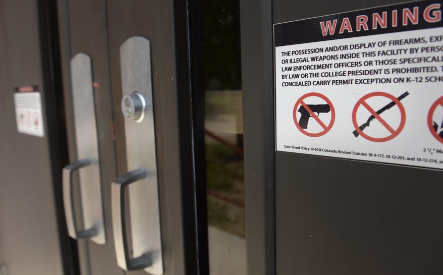 This Aug. 26, 2015 photo shows a sign at an entrances to a Falcon School District 49 school in Falcon, Colo. Amy Wrany is ready. If Colorado lawmakers ever decide to let educators carry concealed firearms in elementary and secondary schools, Wrany, a teacher in Harrison School District 2, probably will be packing heat. (Mark Reis/The Gazette via AP) MAGS OUT; MANDATORY CREDIT