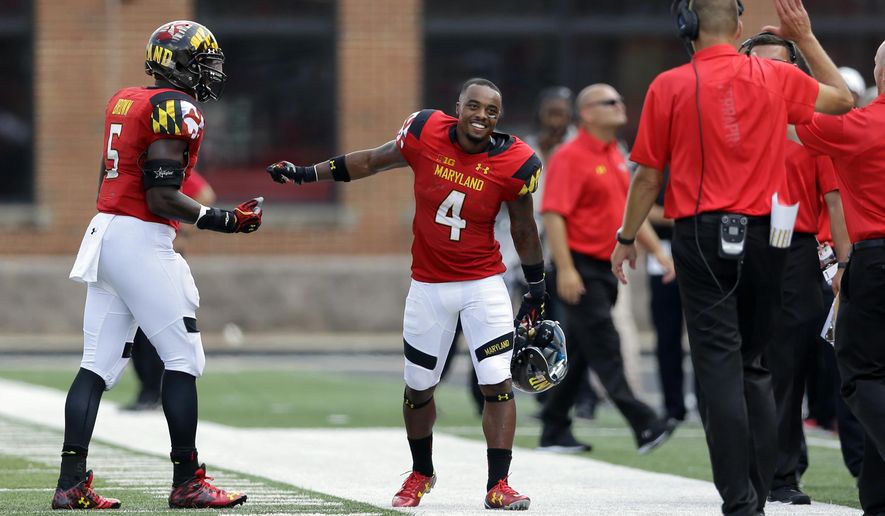 Maryland&#x27;s William Likely (4) celebrates with teammate Wes Brown, left, and head coach Randy Edsall after officials overturned a call to grant him a touchdown in the second half of an NCAA college football game against Richmond, Saturday, Sept. 5, 2015, in College Park, Md. Maryland won 50-21. (AP Photo/Patrick Semansky)