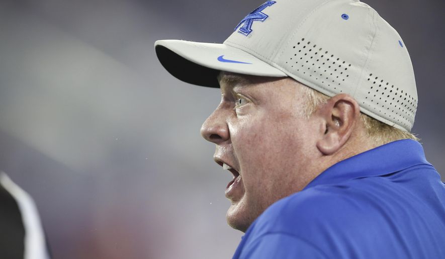 Kentucky head coach Mark Stoops yells at a referee during the second half as his team played Louisiana-Lafayette in an NCAA college football game in Lexington, Ky., Saturday, Sept. 5, 2015. Kentucky won the game 40-33. (AP Photo/David Stephenson)