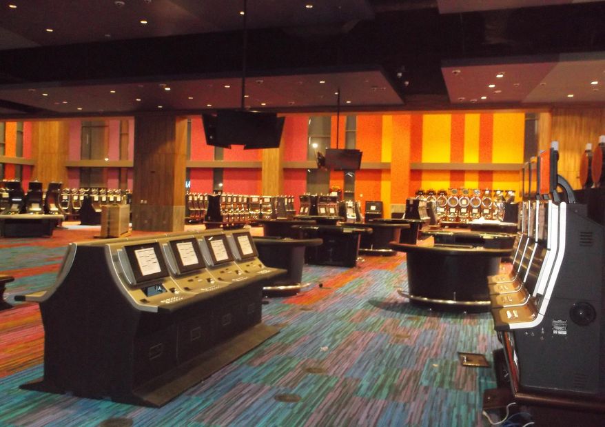 In this July 31, 2015 photo provided by Harrah’s Cherokee Valley River Casino, part of a casino floor is shown in Murphy, N.C. The Cherokee tribe in North Carolina is betting it can boost its income and solidify its hold on gamblers in the Southeast by opening a second casino, even at a time of slow growth in the gambling industry. The casino opening Sept. 28 in the state’s western corner will bring slots and blackjack tables an hour closer to Atlanta, a top source of visitors. (AP Photo/Harrah’s Cherokee Valley River Casino),