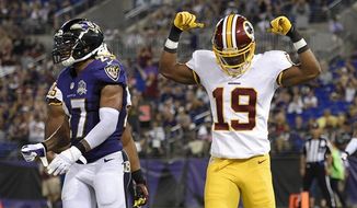 Washington Redskins wide receiver Rashad Ross (19) celebrates his touchdown in front of Baltimore Ravens cornerback Asa Jackson in the second half of a preseason NFL football game, Saturday, Aug. 29, 2015, in Baltimore. (AP Photo/Nick Wass)