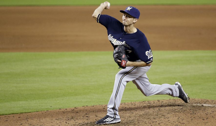 Milwaukee Brewers&#x27; Zach Davies delivers a pitch during the fifth inning of a baseball game against the Miami Marlins, Monday, Sept. 7, 2015, in Miami. (AP Photo/Wilfredo Lee)