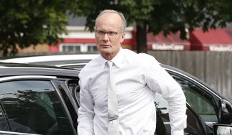 Dentist Walter Palmer, who returned to his practice, Tuesday, Sept. 8, 2015, in Bloomington, Minn., arrives back to his office following a lunch break. Palmer, after weeks out of the public eye, was the subject of an international uproar after he was identified as the hunter who killed the famous lion Cecil, in Zimbabwe. (AP Photo/Jim Mone)