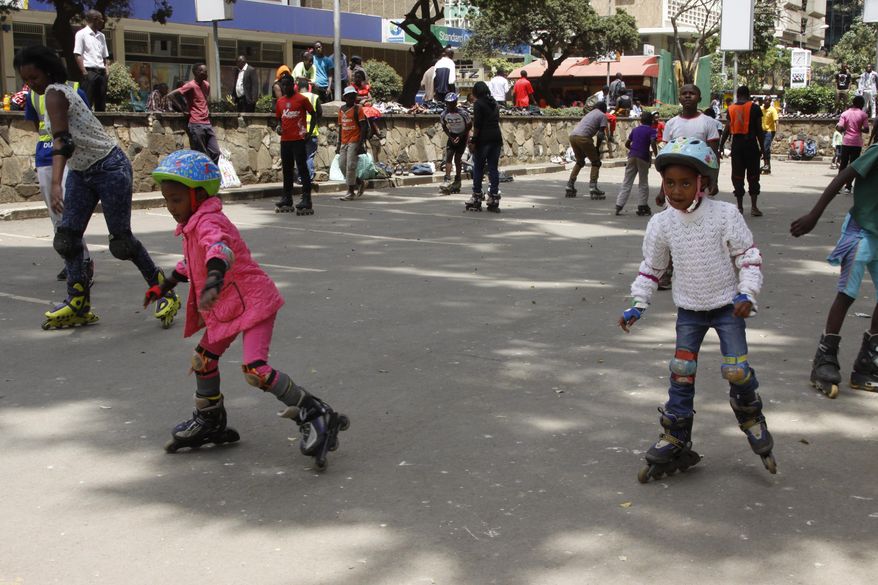 In this photo taken on Sunday, Sept. 6, 2015, young children practice skating in downtown Nairobi , Kenya. A craze for roller skating has hit Kenya, fueled by its growing middle class and a love for speed. Lameck Wafula is the secretary-general of the Kenyan Federation of Roller Skating, which was created in 1997 with four members and now oversees 60 skating clubs. More than 100 schools feature roller skating at gym. A speed-skating tournament in June drew more than 400 participants from all over Kenya with hundreds more watching. A music video by Kenyan hip hop artist Octopizzo features skating. Even the police department sponsors a skating team. (AP Photo/Jay Lawrence)
