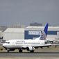 A United Airlines passenger plane lands at Newark Liberty International Airport Wednesday, Sept. 9, 2015, in Newark, N.J. Oscar Munoz, a railroad executive and head of United&#39;s audit committee, was named CEO and president. (AP Photo/Mel Evans)