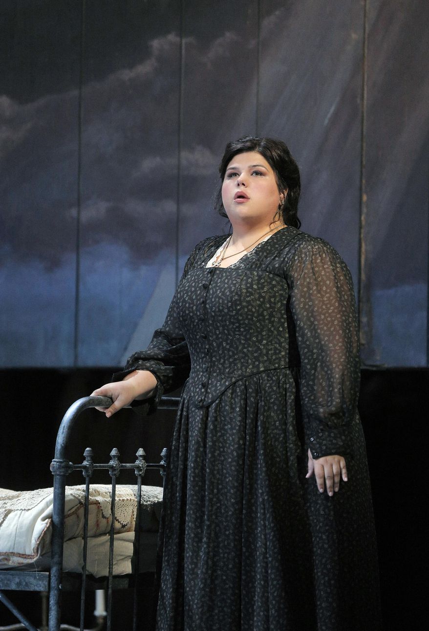 In this Sept. 1, 2015 photo provided by the San Francisco Opera, soprano Leah Crocetto in the title role of Verdi’s "Luisa Miller" during a dress rehearsal in San Francisco. (Cory Weaver/San Francisco Opera via AP)