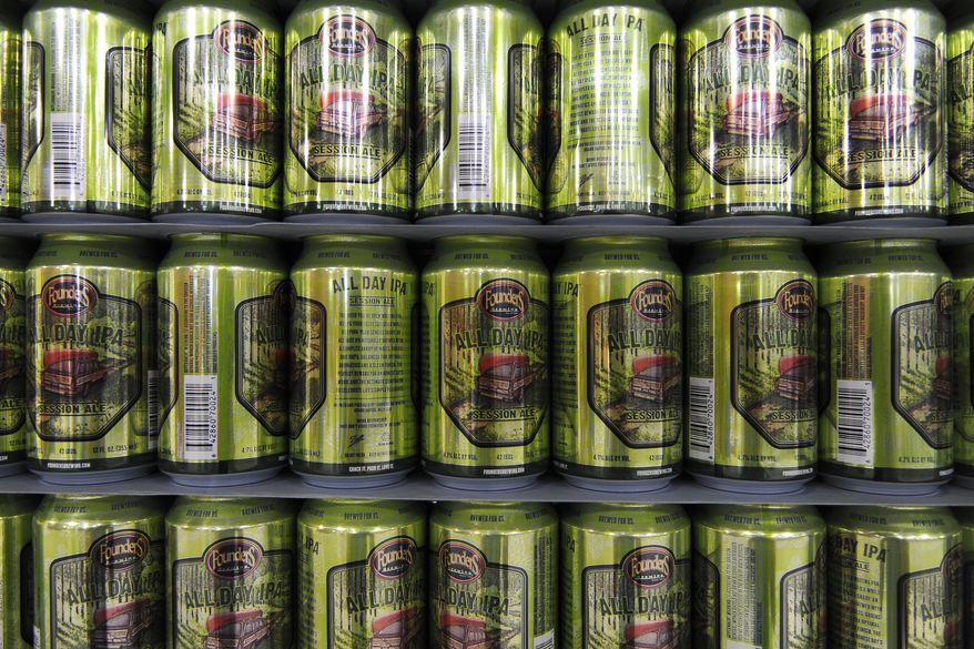 In this photo taken Sept. 3, 2015, cans Founders Brewing's All Day IPA are displayed in Grand Rapids, Mich. The brewer's sales of its popular All Day IPA are driving a $40 million expansion of the craft brewer. (Alex McDougall/The Grand Rapids Press via AP) ALL LOCAL TELEVISION OUT; LOCAL TELEVISION INTERNET OUT; MANDATORY CREDIT
