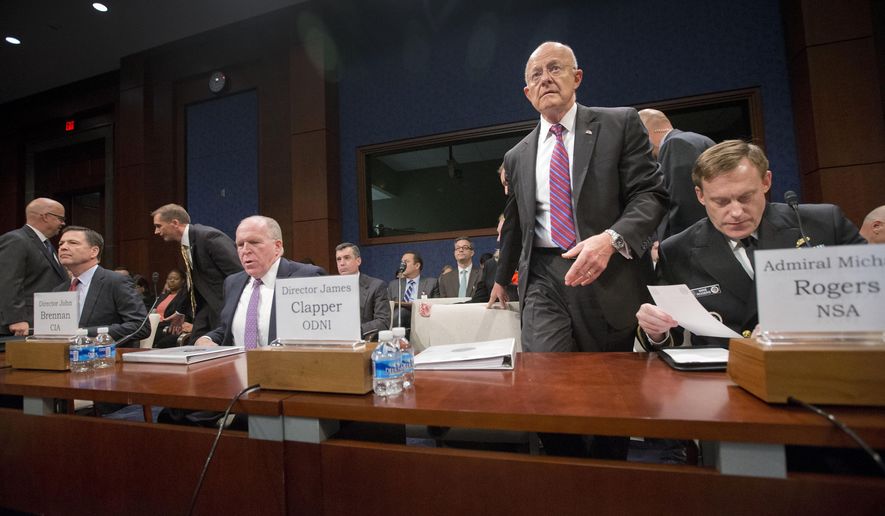 Director of National Intelligence James Clapper, center, takes his seat on Capitol Hill in Washington, Thursday, Sept. 10, 2015, prior to testifying House Intelligence Committee hearing on cyber threats. From left are, FBI Director James Comey, CIA Director John Brennan, and Clapper, and Director of the National Security Agency Adm. Michael Rodgers.  (AP Photo/Pablo Martinez Monsivais)