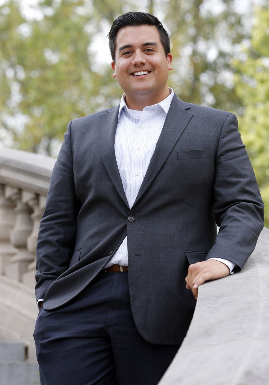 Aaron Ledesma, who will help welcome Pope Francis to Washington later this month poses for a photo in Richmond, Va., Thursday, Sept. 10, 2015. Ledesma recently reconnected with the church and credits Francis with beginning to break down walls for gay and lesbian Catholics who have long felt alienated by the church. (AP Photo/Steve Helber)